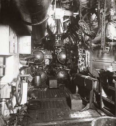 Interior of forward compartment of U-boat 135 showing torpedo and four torpedo tubes by English Photographer